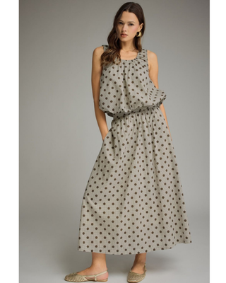 Women's mocha polka dot A-line midi skirt with a high-rise waistband and flowy silhouette in a lightweight woven fabric, styled for an elegant boutique look.