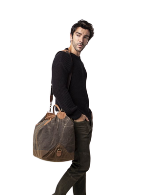 Waxed Weekender in Olive featuring premium waxed canvas, genuine leather handles, removable shoulder strap, and a spacious zip-top travel compartment.