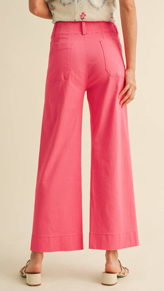 Back view of high waisted wide leg cropped bright pink trouser pants 